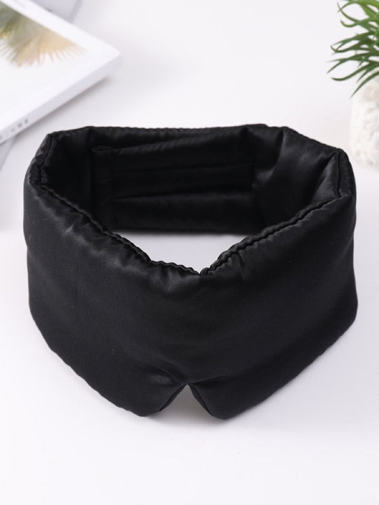 Black SilkRest silk sleep mask laid flat