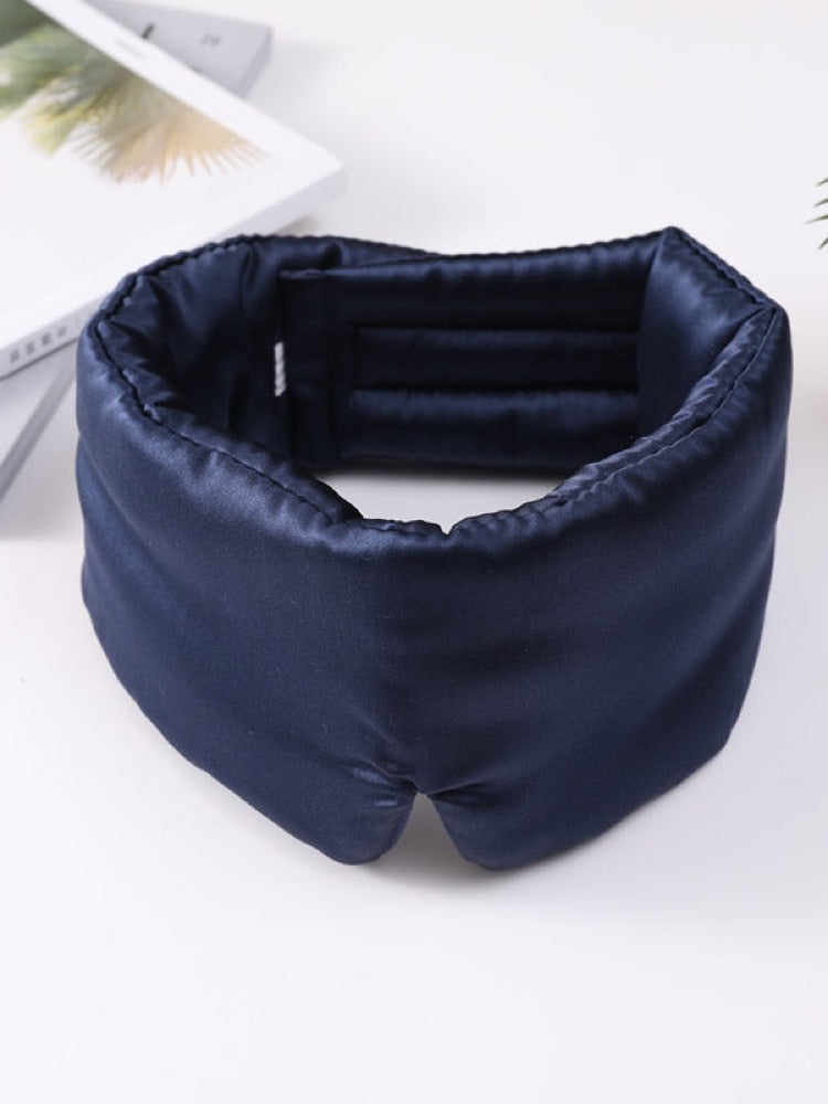Navy SilkRest silk sleep mask laid flat