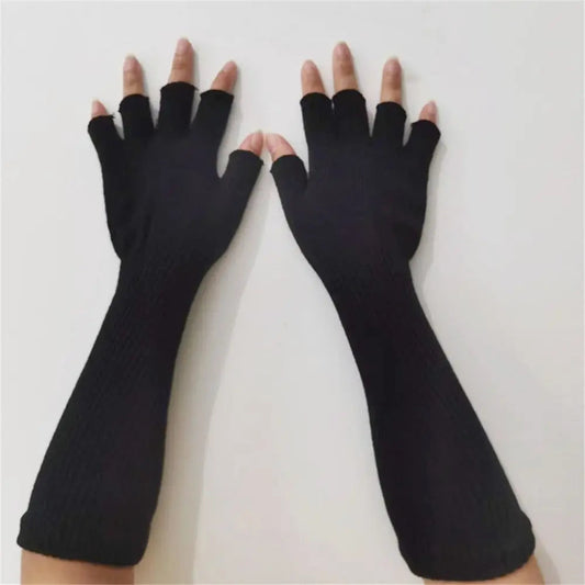 Long black fingerless gloves worn on both hands and forearms