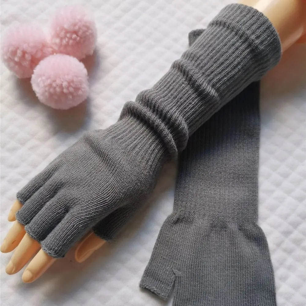 Grey long fingerless glove worn on the arm, with half fingers and thumb