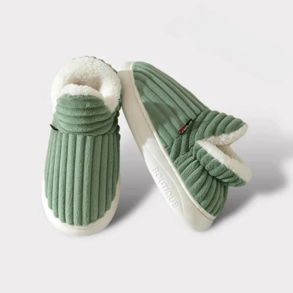 Pair of green WarmStep winter slippers