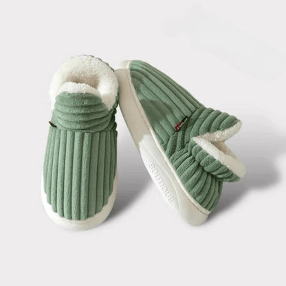 Pair of green WarmStep winter slippers