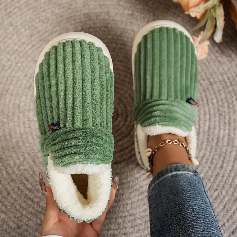 Green WarmStep winter slippers seen from above